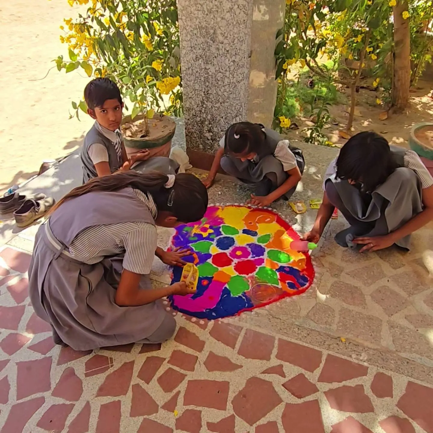 Students making rangoli